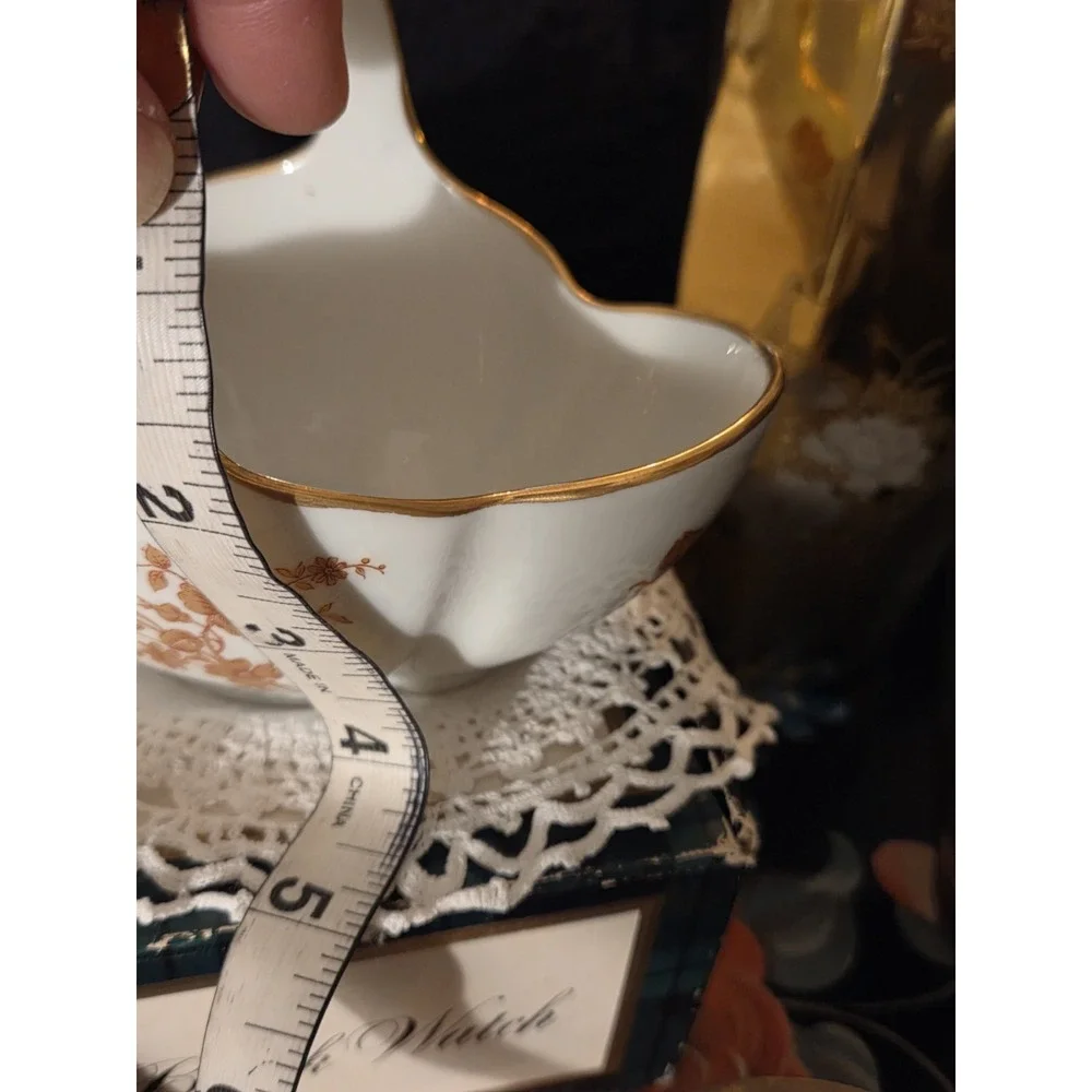 vintage Limoges, France, porcelain compote basket featuring a tall arched...